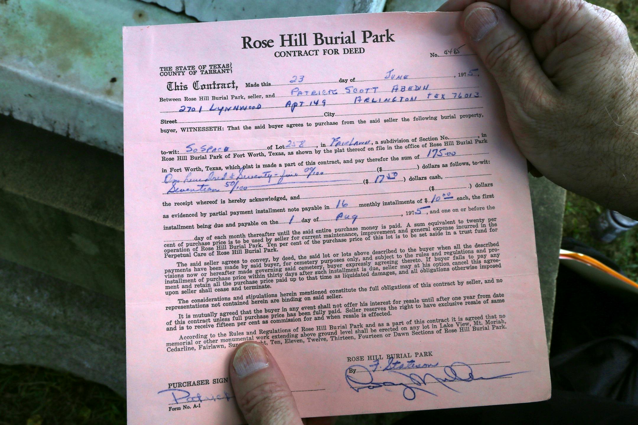 Patric Abedin, who sometimes goes by Nick Beef, a long-held persona, holds a contract from 1975 for a burial plot, in New York, Aug. 2, 2013. Conspiracy theorists and assassination buffs have been vexed for 15 years by the appearance of a granite marker with the engraving "Nick Beef" next to Lee Harvey Oswald's grave in Texas, a burial plot Abedin purchased over a decade ago. (Nicole Bengiveno/The New York Times)