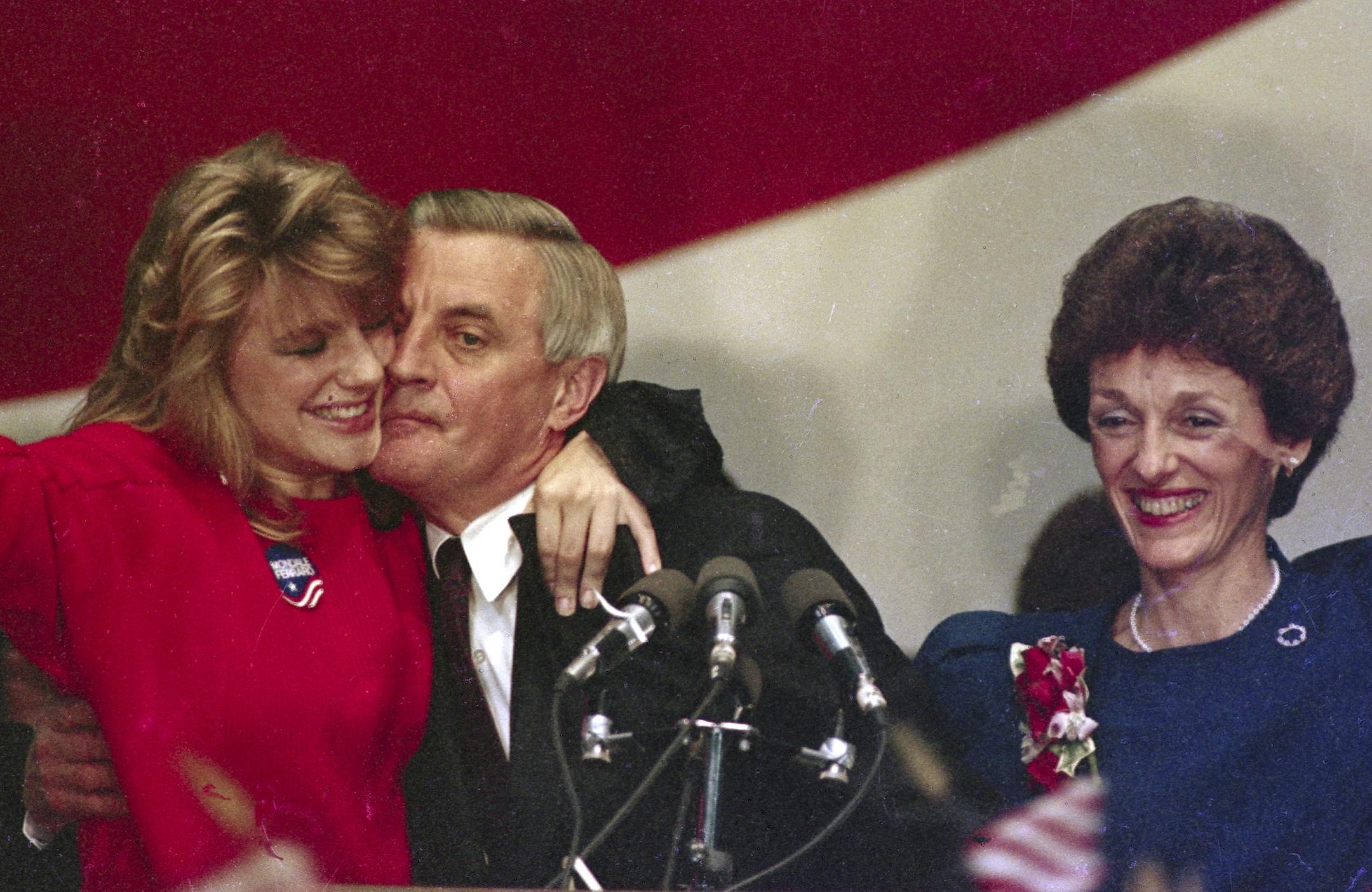 Walter Mondale is hugged by his daughter Eleanor as his wife Joan looks on at the St. Paul Civic Center in Minn., where Mondale conceded to President Reagan, Nov. 7, 1984.