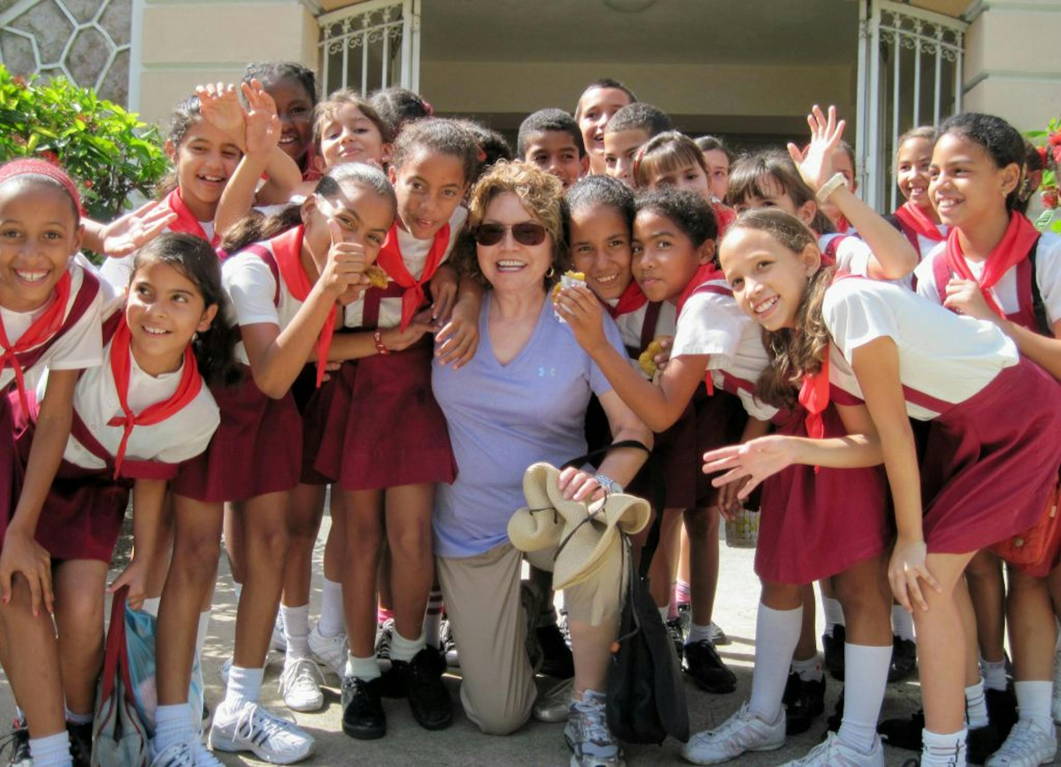 Mary Cowden of Kingsport, Tenn., posed with a troop of Cuban girl scouts.