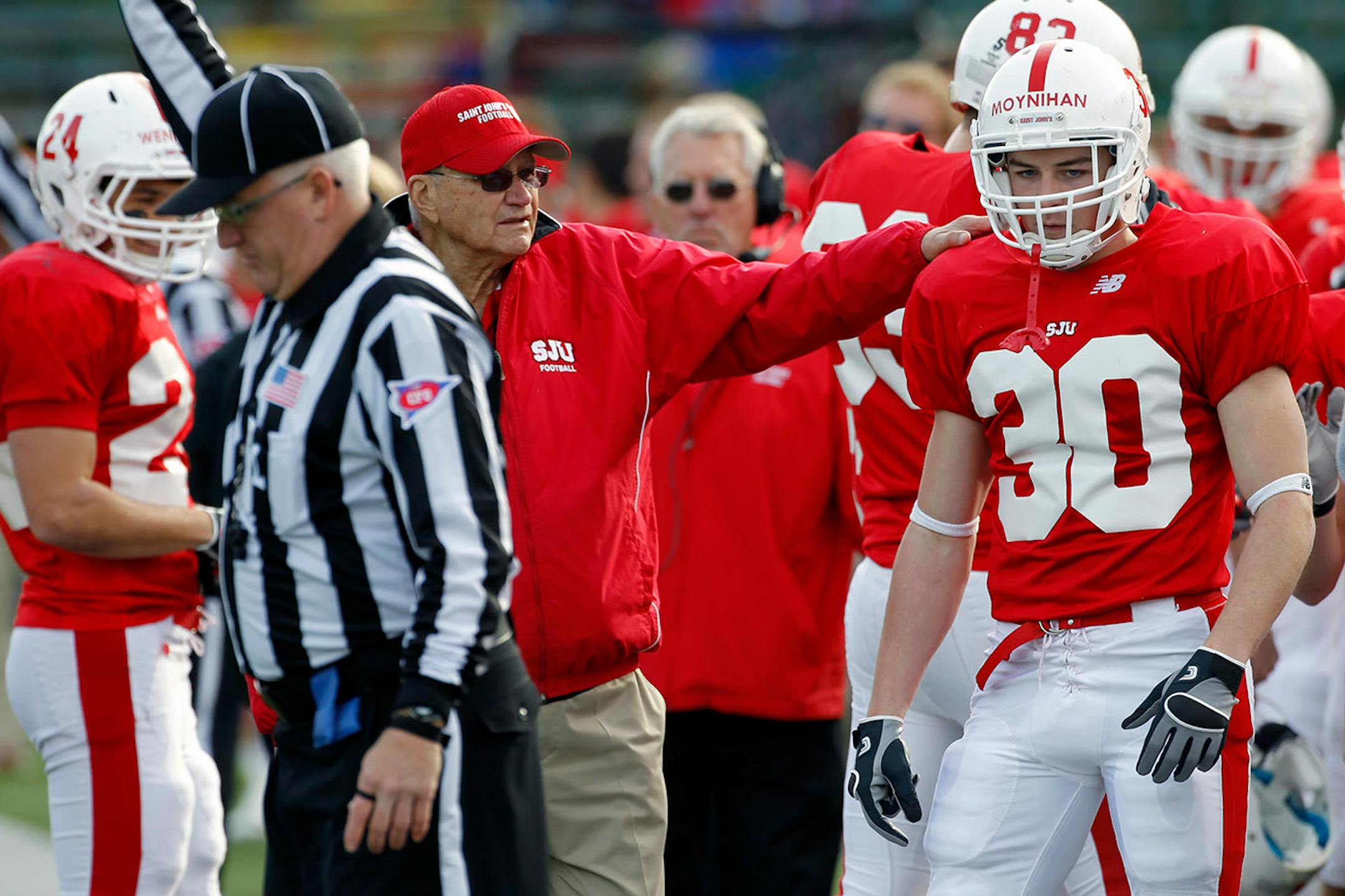 St. John's football coach John Gagliardi let Colin Moynihan know he did the right thing in making a fair catch against Carleton.
