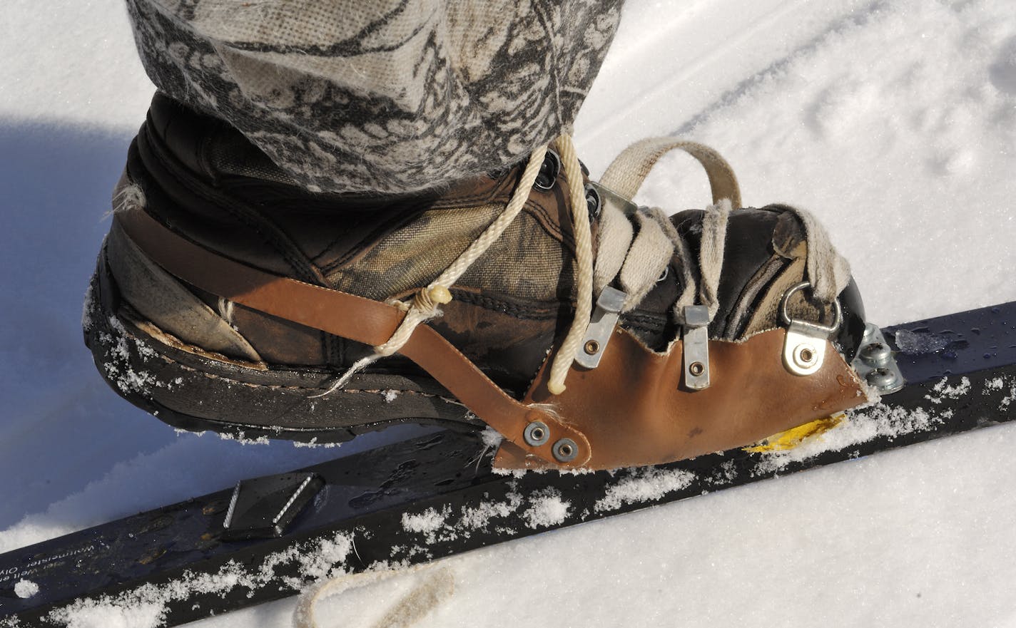 Snowshoe bindings are easily attached to cross-country skies, allowing boots of any size or style to be worn. Photo by Bill Marchel