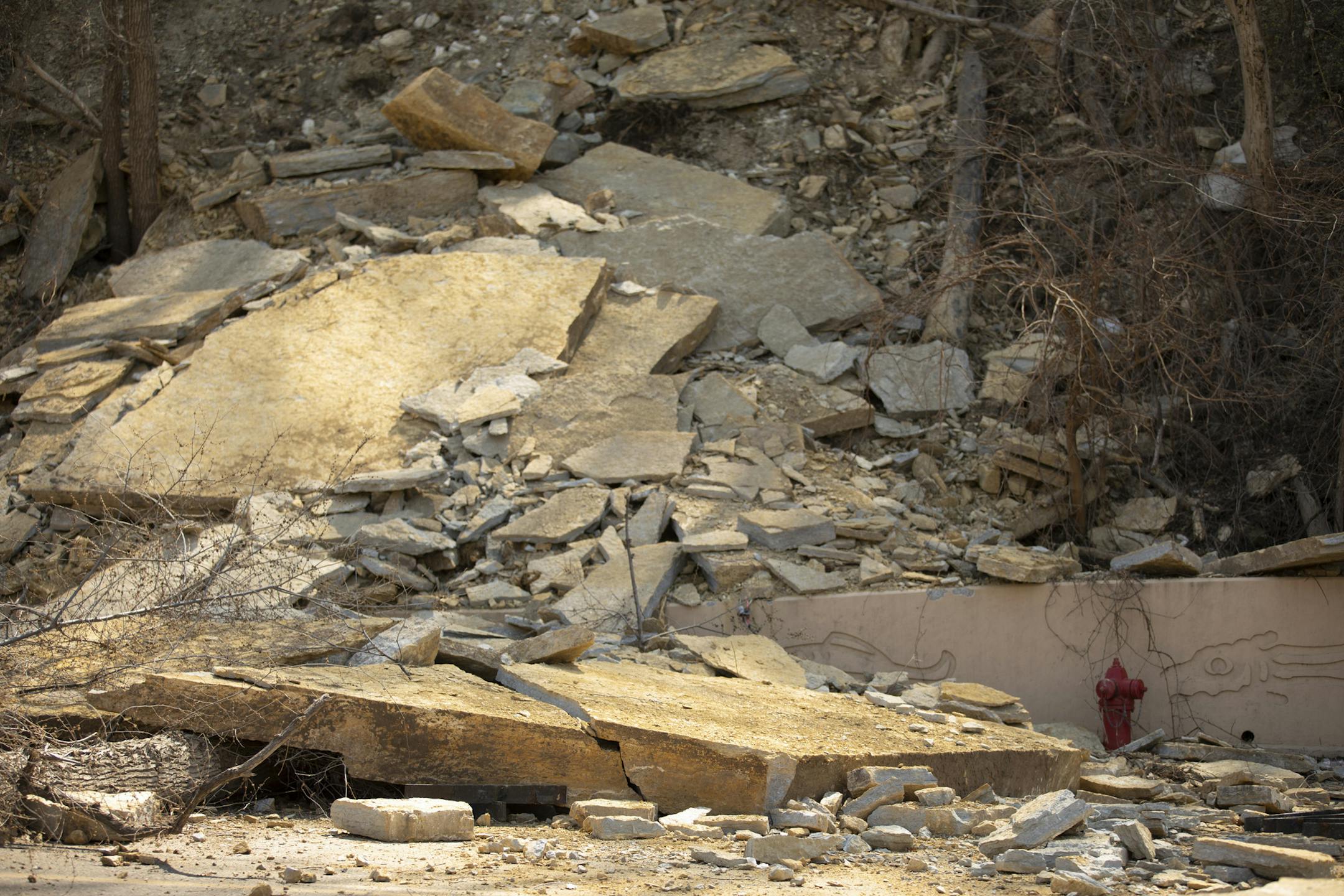 Debris covers Wabasha St. after breaking off from the bluff above. ] JEFF WHEELER ï jeff.wheeler@startribune.com A portion of the bluff broke off above Wabasha St. on St. Paul's West Side over the weekend, closing the street until city engineers decide whether to preemptively remove some more of the bluff to prevent another landslide. The aftermath was photographed Tuesday afternoon, May 1, 2018 in St. Paul.