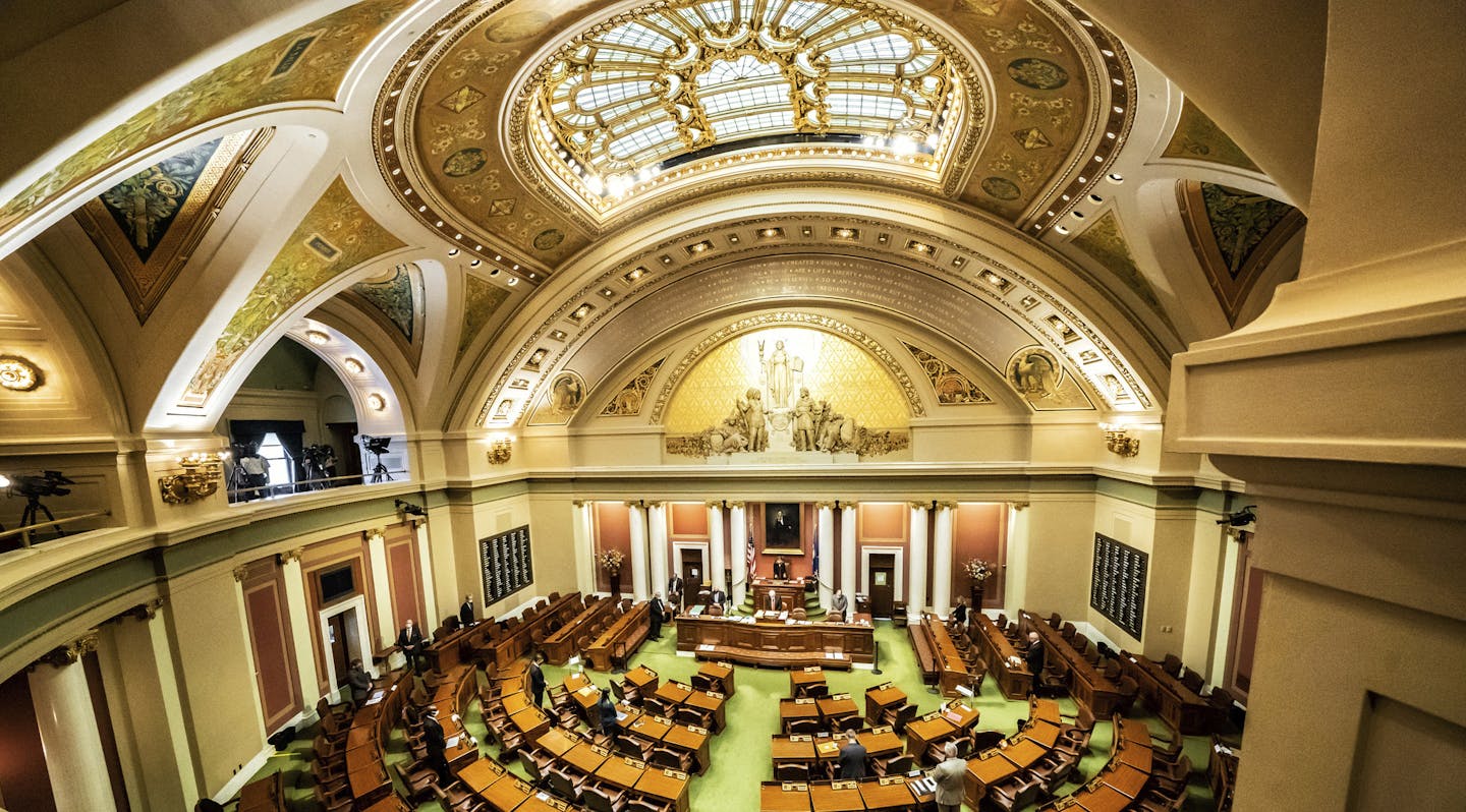 Democratic House Speaker Melissa Hortman, of Brooklyn Park calls for members to stand in silence and bow their heads for 8 Minutes and 46 seconds in honor of George Floyd Friday, June 12, 2020, as the Minnesota State Legislature met in a special session. (Glen Stubbe/Star Tribune via AP)