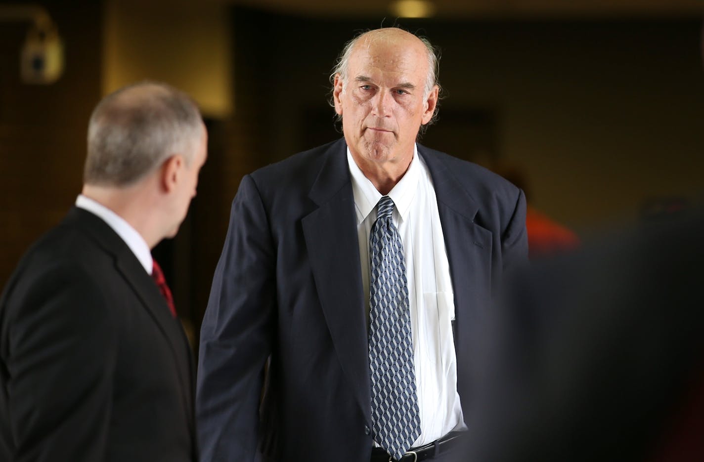 Former Minnesota Gov. Jesse Ventura made his way back into the Warren E. Burger Federal Building during the first day of jury selection in the defamation lawsuit, Tuesday, July 8, 2014 in St. Paul, MN.