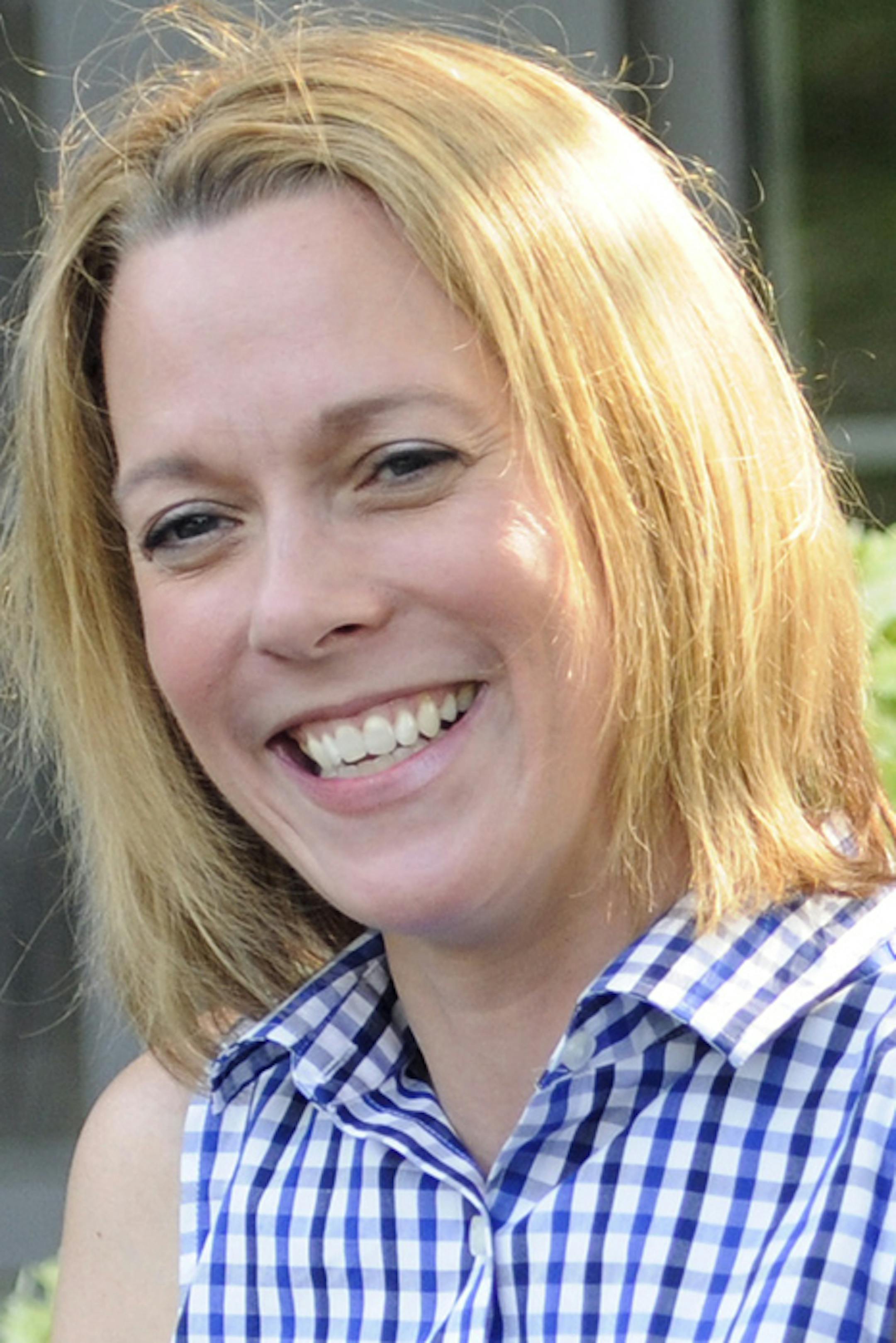 Shelia Kihne, of Eden Prairie talks about her campaign in the front yard of her house in Eden Prairie, Minn. Wednesday, July 30, 2014. Kihne faces incumbent Rep. Jenifer Loon (R) in the Republican primary election on August 12. (AP Photo/Craig Lassig) ORG XMIT: MIN2014080515455335