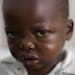 Three-year-old Jonathan Kangu sits on his hospital bed in Kinshasa, Congo, on Tuesday, July 19, 2016, suffering from symptoms of yellow fever, includi