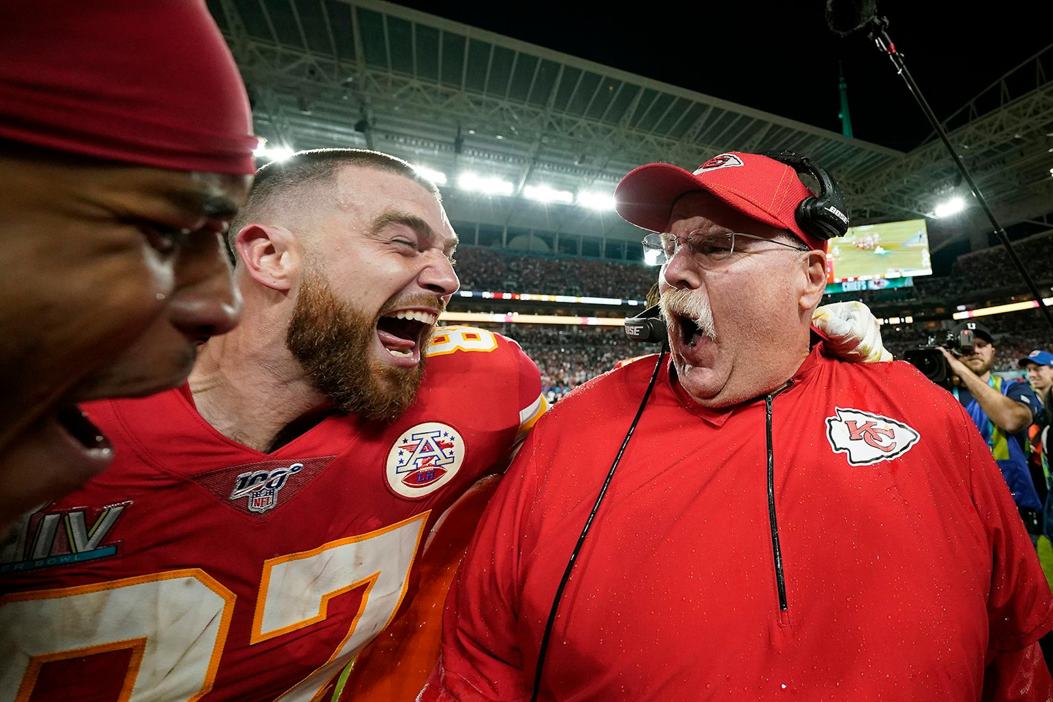Kansas City Chiefs' Travis Kelce, left, celebrates with head coach Andy Reid after defeating the San Francisco 49ers in the NFL Super Bowl 54 football game Sunday, Feb. 2, 2020, in Miami Gardens, Fla.