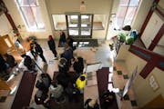 The check-in line snaked around the lobby during a felony-level expungement clinic inside the Urban League Twin Cities office in Minneapolis on Wednes
