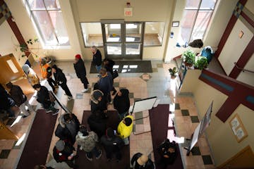 The check-in line snaked around the lobby during a felony-level expungement clinic inside the Urban League Twin Cities office in Minneapolis on Wednes