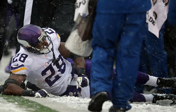 Vikings running back Adrian Peterson on the sideline after injuring his ankle in the second quarter of the game against the Baltimore Ravens.