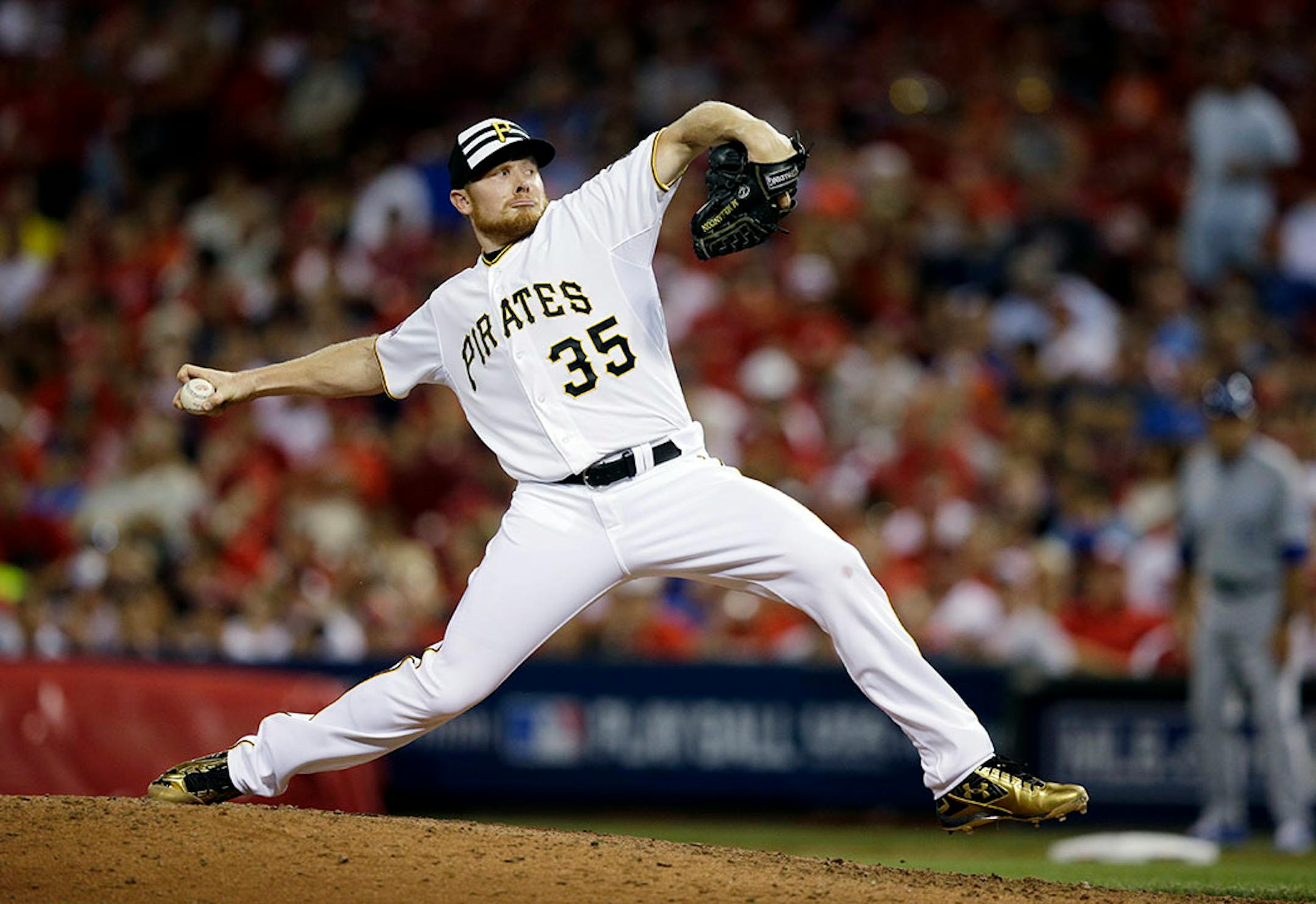 National League's Mark Melancon, of the Pittsburgh Pirates, throws during the eighth inning of the MLB All-Star baseball game, Tuesday, July 14, 2015, in Cincinnati.