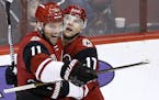 Arizona Coyotes center Martin Hanzal (11) smiles as he celebrates his game-winning goal against the San Jose Sharks with right wing Radim Vrbata (17) 