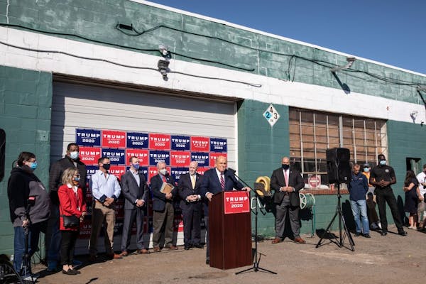 Attorney for the President, Rudy Giuliani speaks to the media at a press conference held in the back parking lot of landscaping company on November 7,