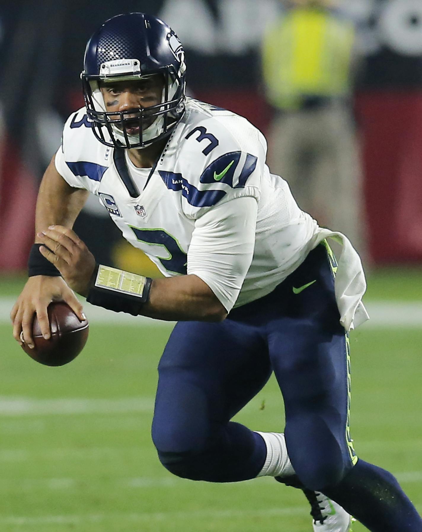 Seattle Seahawks quarterback Russell Wilson (3) during the first quarter of an NFL football game against the Arizona Cardinals, Sunday, Dec. 21, 2014 in Glendale, Ariz. (AP Photo/Rick Scuteri)