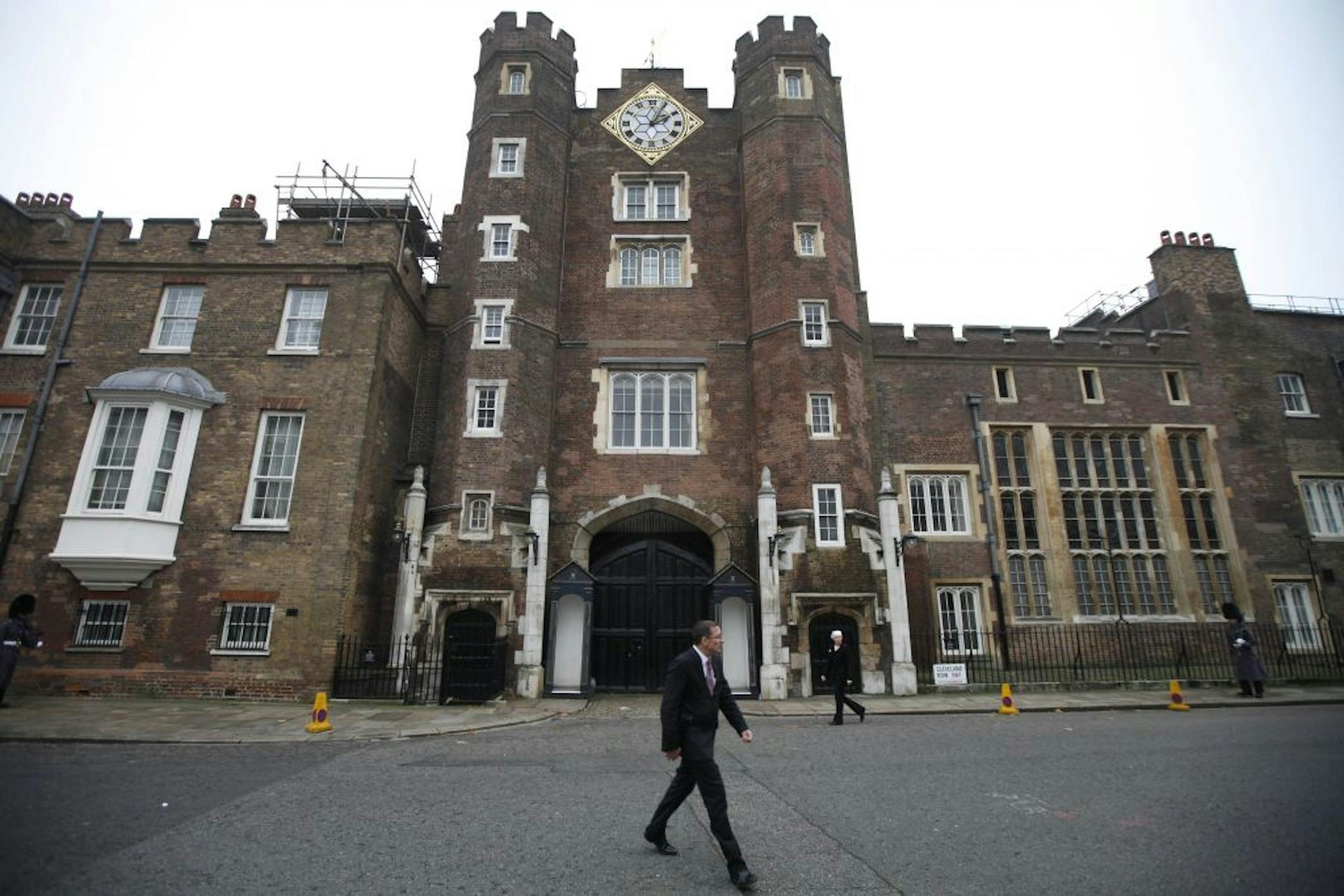 People walk past St. James Palace in central London, Monday, Nov. 14, 2011. Queen Elizabeth II has given her approval to renting out state apartments at St. James's Palace as party venues during the 2012 London Olympics. Buckingham Palace says holders of royal warrants _ companies with long-standing ties to the royal family _ will be given a chance to rent state apartments during the games, which begin on July 27 and last until Aug. 12.