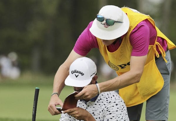 Erik van Rooyen and caddie Alex Gaugert — both former Gophers golfers — tried to stick to the book during a wind-blown final round of the PGA Cham