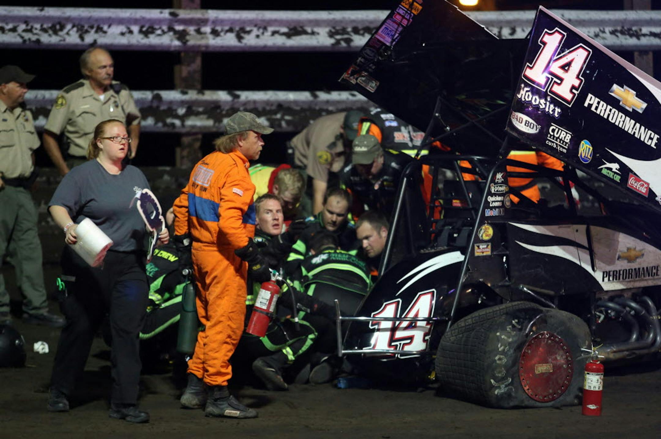 Aug. 5, 2013: Personnel prepare to load NASCAR driver Tony Stewart into an ambulance after being involved in a four-car wreck at Southern Iowa Speedway in Oskaloosa, Iowa.
