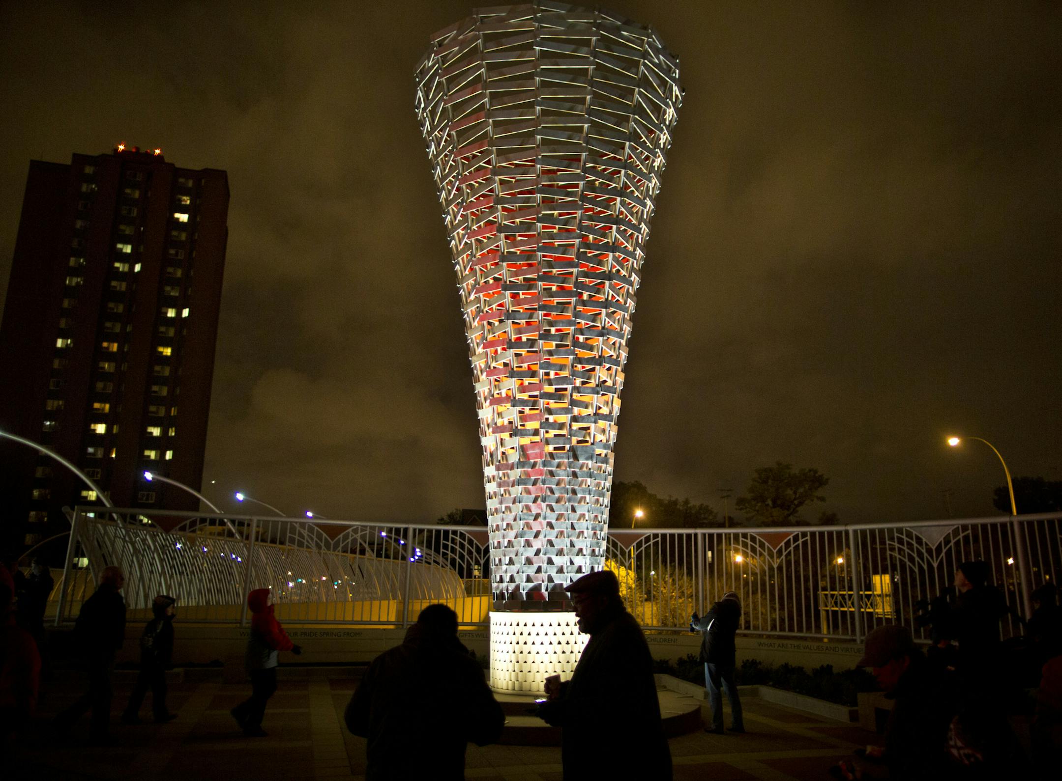 A sculpture called Beacon by artist Janet Lofquist was lit up during a bridge dedication and lighting ceremony for the new sculpture dedicated to the former Minneapolis Mayor Sharon Sayles Belton at 3rd Avenue South over Interstate 94 on Tuesday, October 22, 2013, in Minneapolis, Minn. ] RENEE JONES SCHNEIDER • reneejones@startribune.com