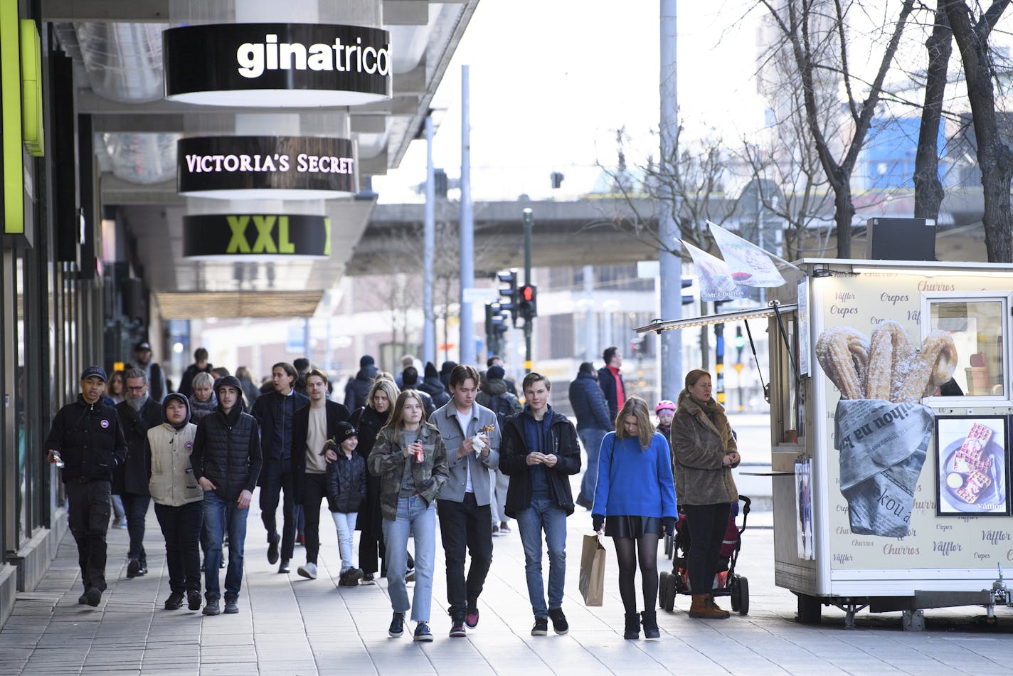 People walk together during the coronavirus pandemic in Stockholm, Sweden, Saturday, April 4, 2020. Swedish authorities have advised the public to practice social distancing because of the coronavirus pandemic, but still allow a large amount of personal freedom, unlike most other European countries. The new coronavirus causes mild or moderate symptoms for most people, but for some, especially older adults and people with existing health problems, it can cause more severe illness or death. (Henri