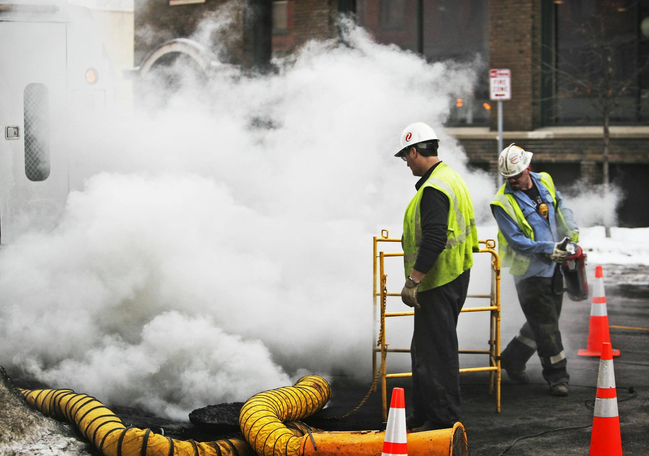 Xcel Energy workers tended to an underground electrical fire near 210 2nd St. N. that sent smoke pouring onto the street and required the evacuation of people nearby Tuesday, Feb. 26, 2013, in Minneapolis, MN.] (DAVID JOLES/STARTRIBUNE) djoles@startribune.com Tuesday , Feb. 26, 2013, An underground electrical fire near 210 2nd St. N. sent smoke pouring onto the street and required the evacuation of people nearby, according to a spokesperson for Xcel Energy. Patti Nystuen said the fire was likely