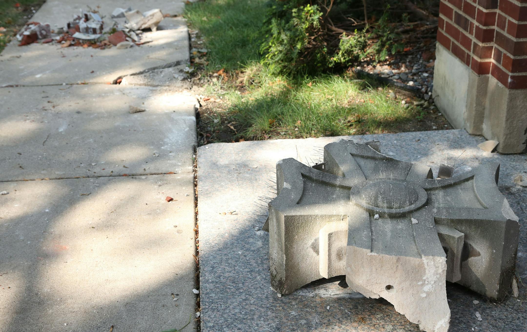 Some of the remains of the cross that was struck by lighting on the roof of St. Helena Catholic Church. ] (KYNDELL HARKNESS/STAR TRIBUNE) kyndell.harkness@startribune.com in Minneapolis, Min., Wednesday September 2, 2015.