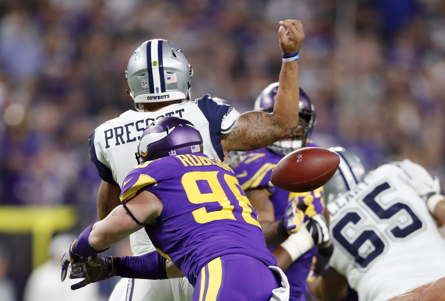 Minnesota Vikings defensive end Brian Robison (96) forced a fumble on Dallas Cowboys quarterback Dak Prescott (4) in the third quarter , the ball was recovered \by Minnesota Vikings defensive end Everson Griffen (97) at U.S. Bank Stadium Thursday December 01,2016 in Minneapolis MN. The Minnesota Vikings hosted the Dallas Cowboys ] Jerry Holt / jerry. Holt@Startribune.com