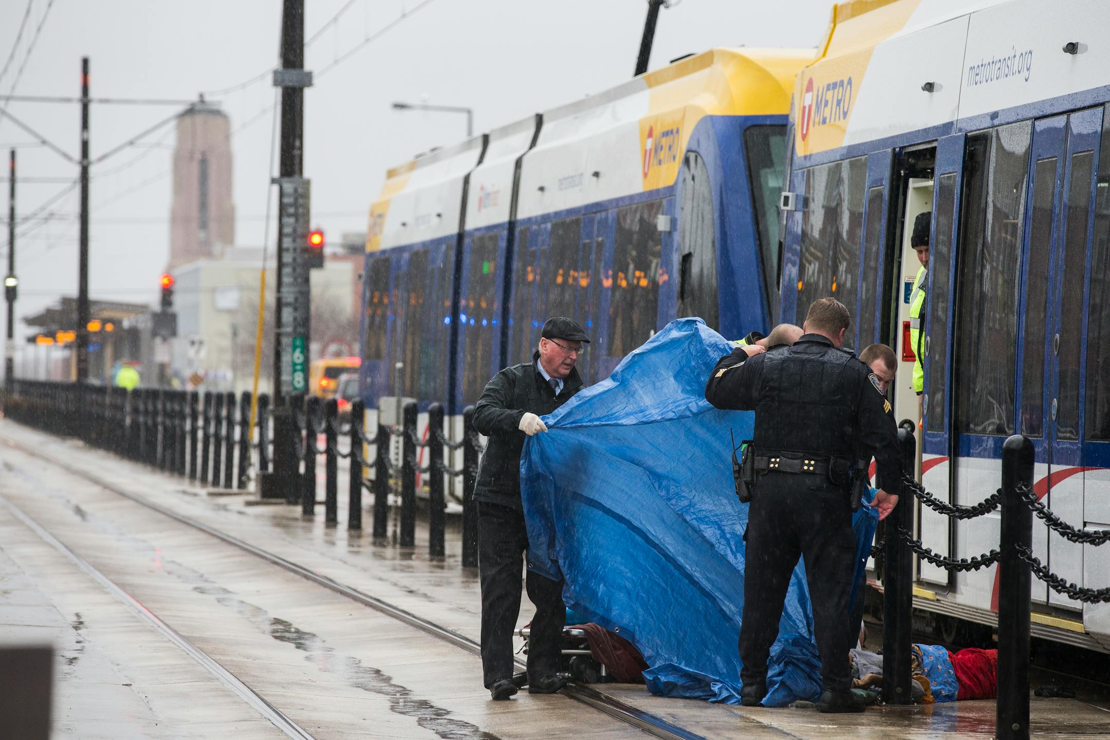 Metro Transit Police and other authorities investigate a fatality on the Green Line train tracks near Hamline Avenue in St. Paul on Thursday, December 10, 2105.