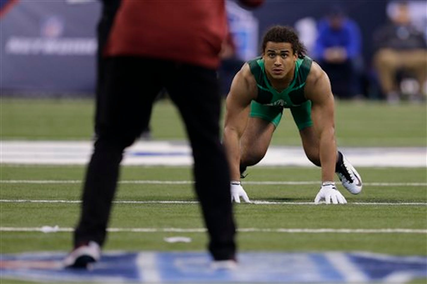 UCLA linebacker Eric Kendricks runs a drill at the NFL football scouting combine in Indianapolis, Sunday, Feb. 22, 2015. (AP Photo/Julio Cortez)