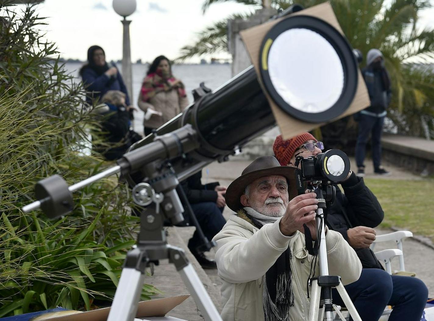 A man takes pictures of a total solar eclipse in Chascomus, Argentina, Tuesday, July 2, 2019. A solar eclipse occurs when the moon passes between the Earth and the sun and scores a bull’s-eye by completely blocking out the sunlight. (AP Photo/Gustavo Garello)