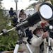A man takes pictures of a total solar eclipse in Chascomus, Argentina, Tuesday, July 2, 2019. A solar eclipse occurs when the moon passes between the 