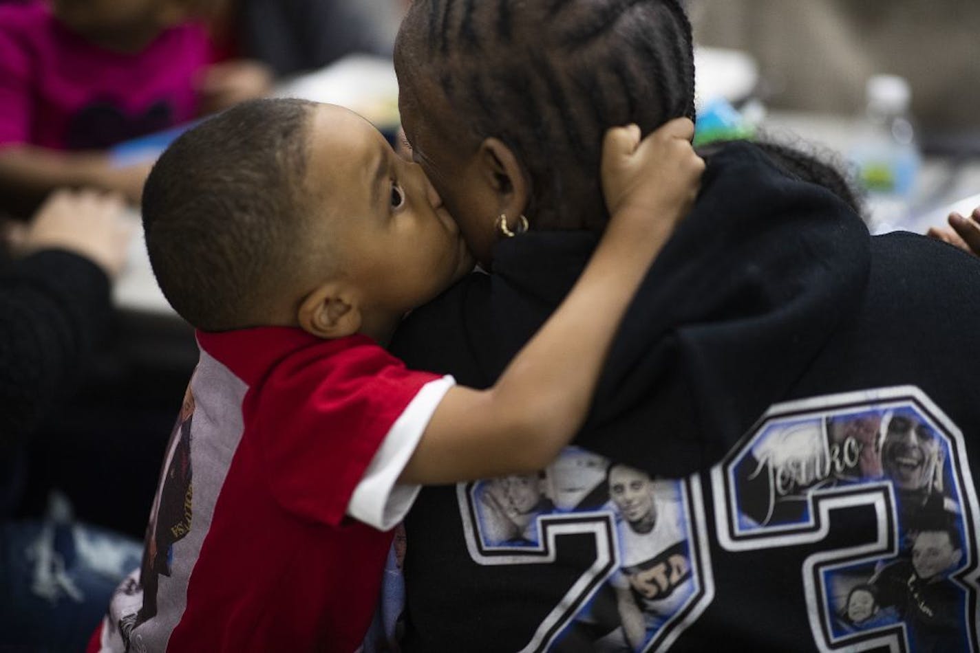 Jeriko Dejvaun Boykin Jr., 4, kissed his grandmother Catherine Harris at a listening session Tuesday about the violence in St. Paul. Jeriko Jr. was in the car when his dad, Jeriko Dejvaun Boykin Sr., was shot and killed last month.