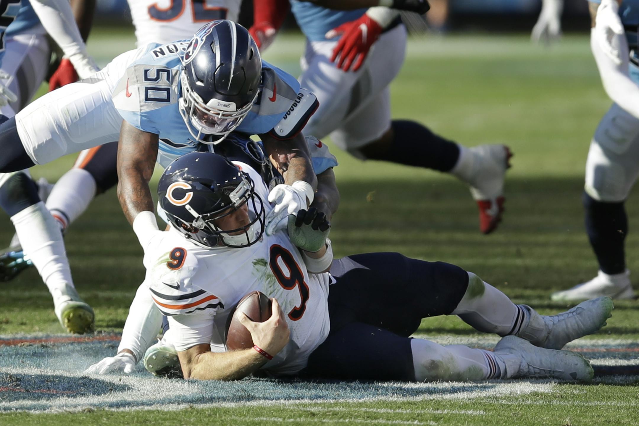 Tennessee Titans linebacker Derick Roberson (50) brings down Chicago Bears quarterback Nick Foles (9) in the second half of an NFL football game Sunday, Nov. 8, 2020, in Nashville, Tenn. (AP Photo/Ben Margot)