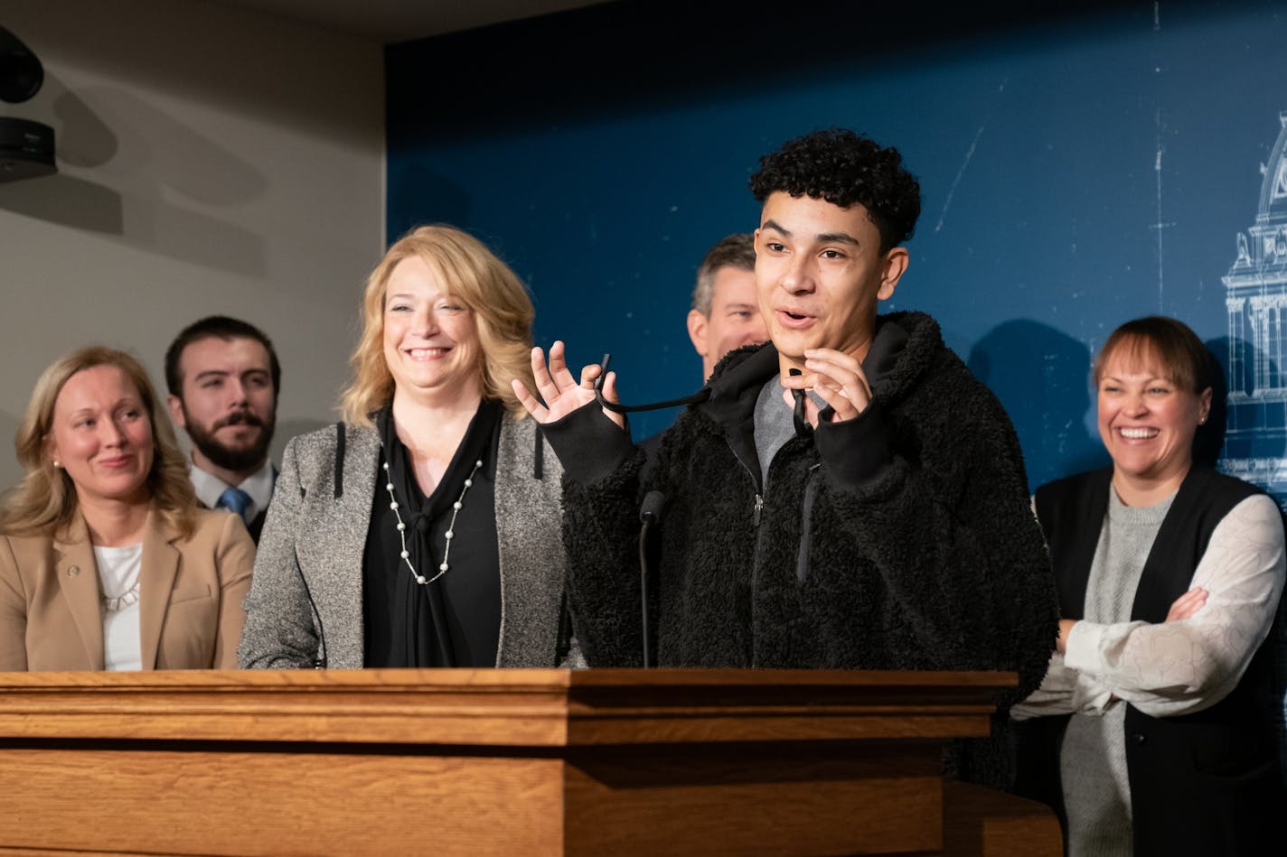 Legislators laughed at a news conference Monday as Yasiel Santiago-Castillo assured them that he has never used a vaping device disguised as a hoodie drawstring. On his left is Rep. Laurie Halverson, D-Eagan; at right is Rep. Alice Mann, DFL-Lakeville, a physician.