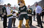 Nordy dances with Wild fans during a Minnesota Wild pep rally at Mears Park in downtown St. Paul.