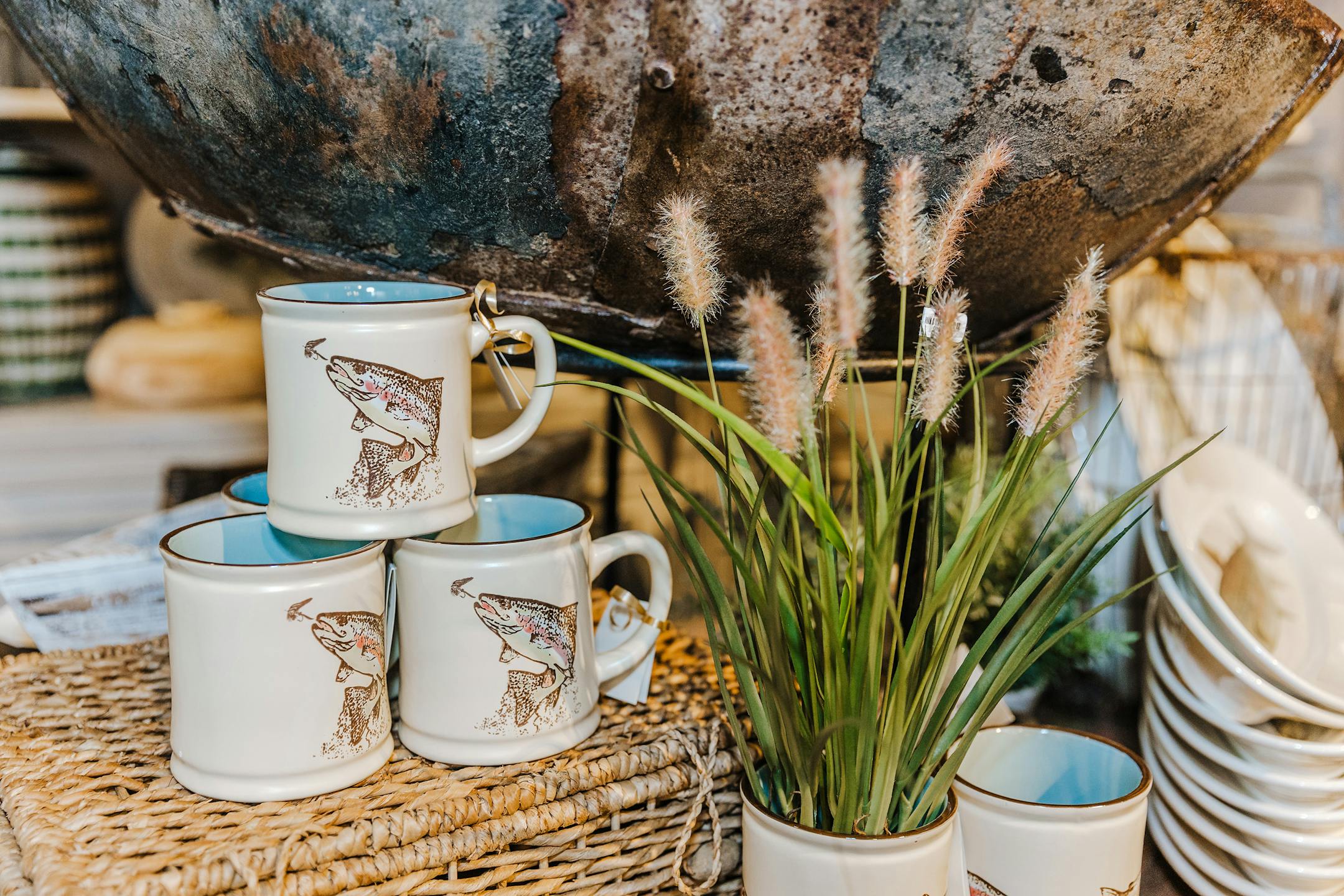 Forgo the flowers you would usually set around your space with other varieties of greens like cattails for a rustic and nature-forward touch. (Handout/TNS)