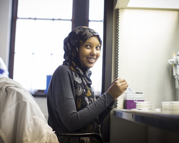 University of Minnesota student Kowsar Mohamed, 19, works part time and volunteers in this research lab at the U.