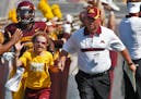 University of Minnesota vs. New Mexico State football. New Mexico State won 28-21. Head Minnesota football coach Jerry Kill, right led 10-year-old can