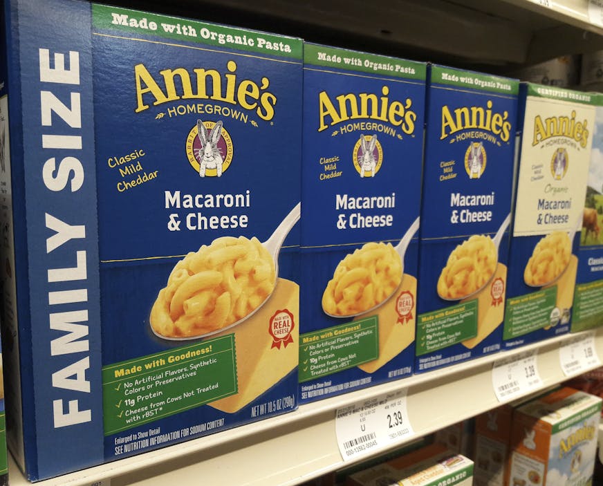 Boxes of Annie's Macaroni & Cheese are shown on the shelf at a supermarket in Edina, Minn., Sunday, March 4, 2018. Annie's is an organic and natural unit of food industry giant General Mills, which announced a deal Tuesday to create a 34,000-acre organic farm in South Dakota to supply it with organic wheat that will become pasta for the popular product. (AP Photo/Steve Karnowski)