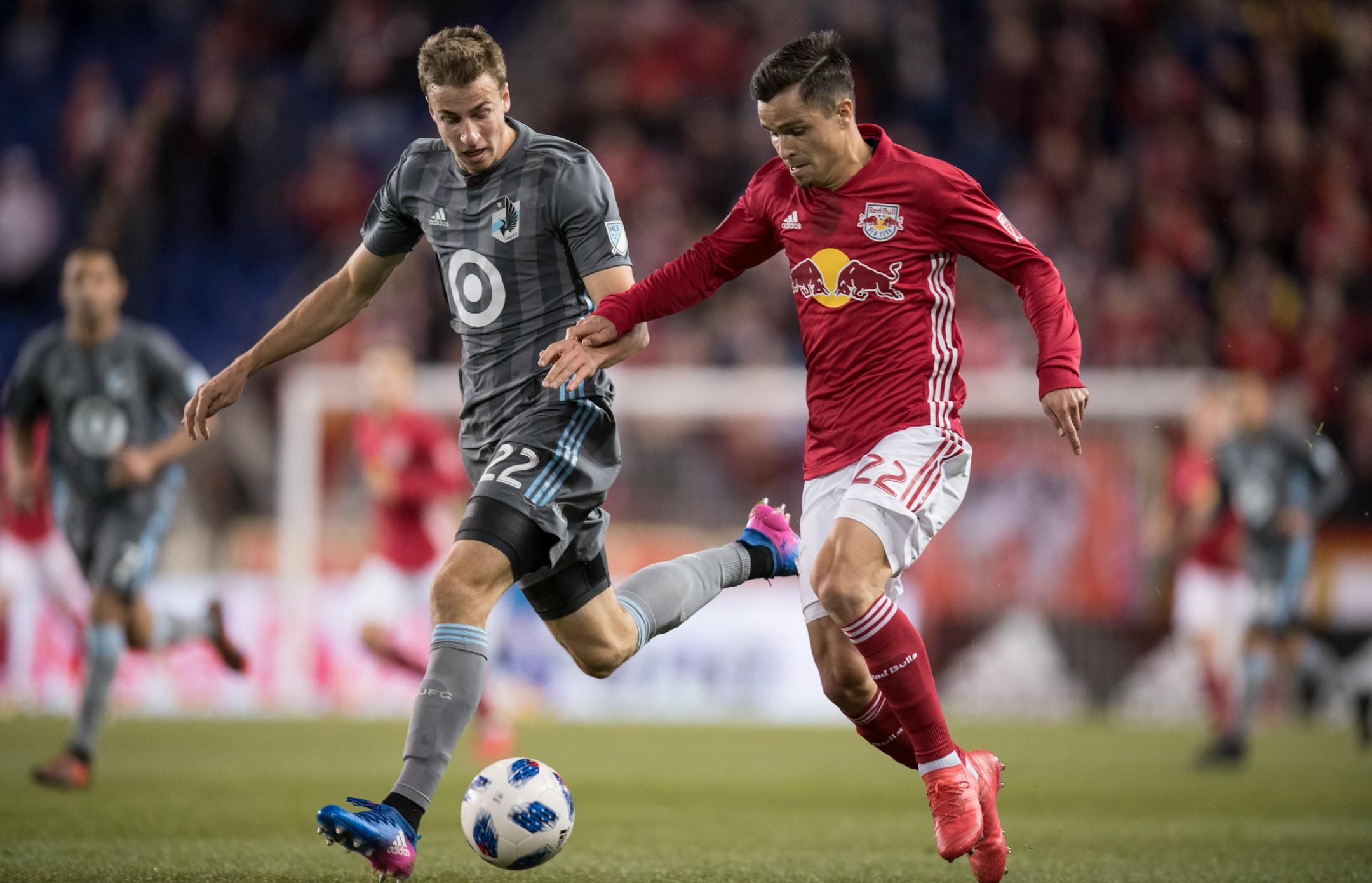 Wyatt Omsberg #22 of Minnesota United FC battles for the ball with Florian Valot #22 of New York Red Bulls during a regular season game at Red Bull Arena on Saturday night, March 24, 2018.
(Ben Solomon for the Minneapolis Star Tribune)