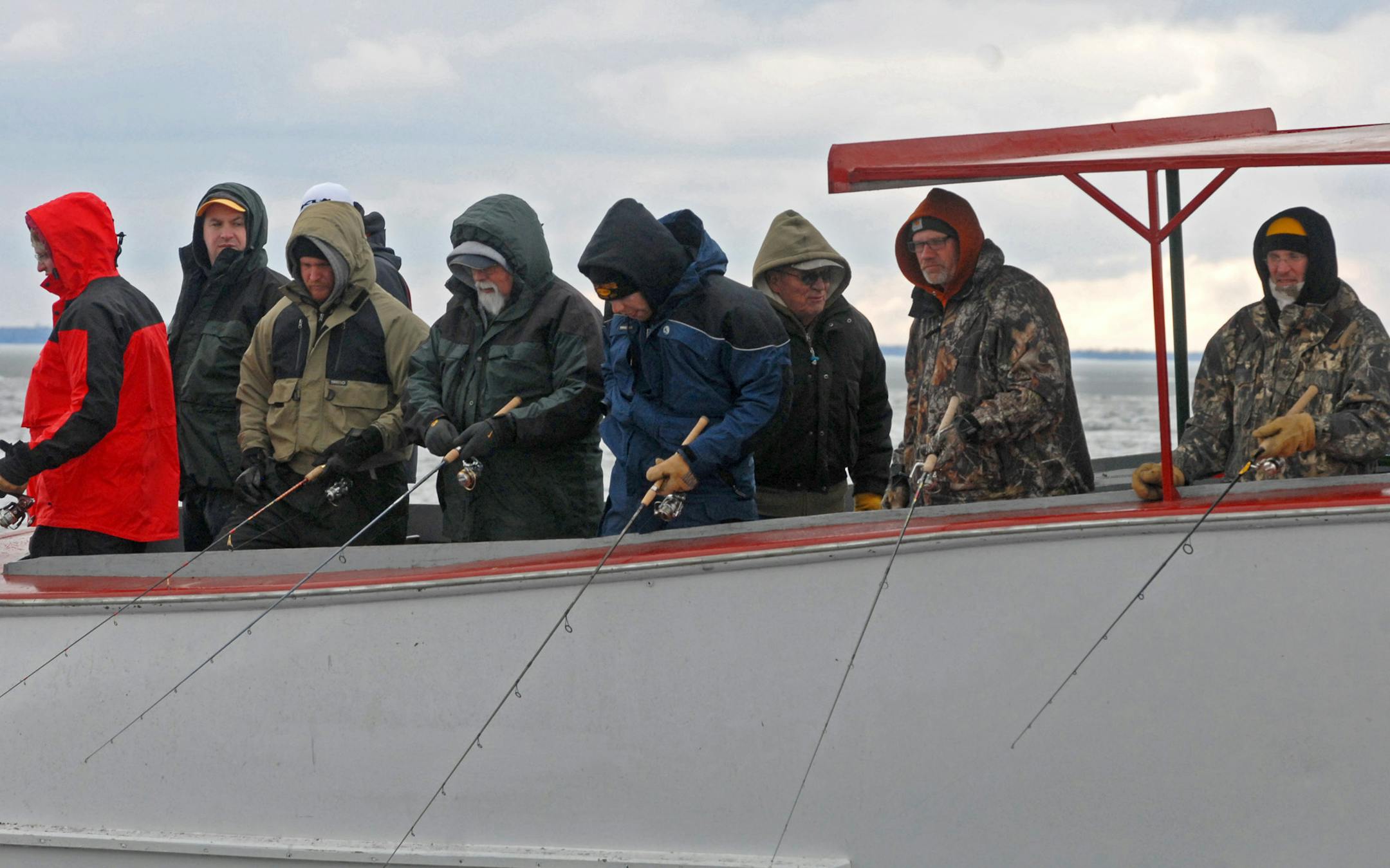 Huddled against the cold while attempting to fool a few walleyes to eat for dinner, these anglers on a Lake Winnibigoshish launch owned by McArdle's Resort tried their luck on opening day. Fishing was tough.