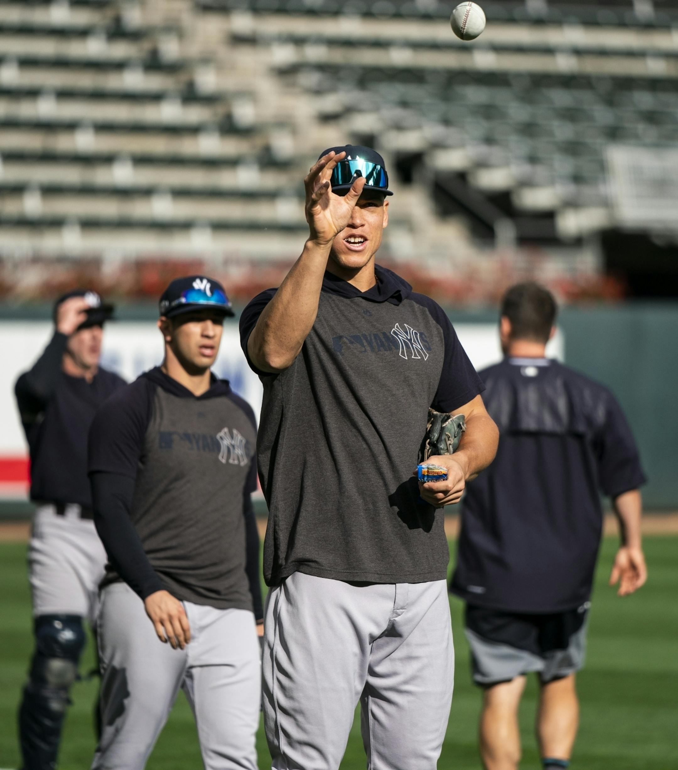 New York Yankees right fielder Aaron Judge (99) caught a ball with his bare hand during a workout.