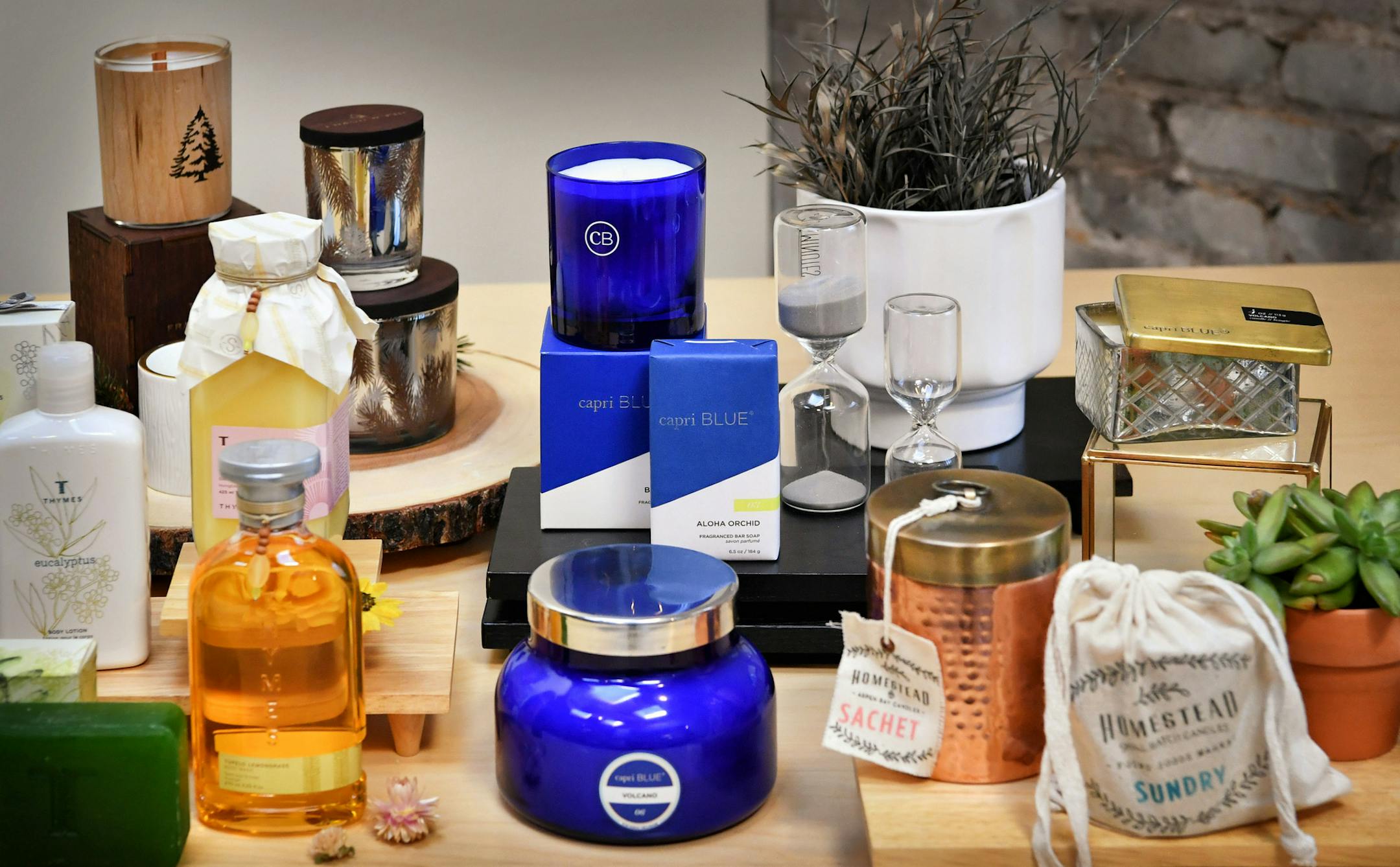 Thymes and DPM’s Capri Blue and Aspen Bay products are the two separate brands under the new Curio umbrella.