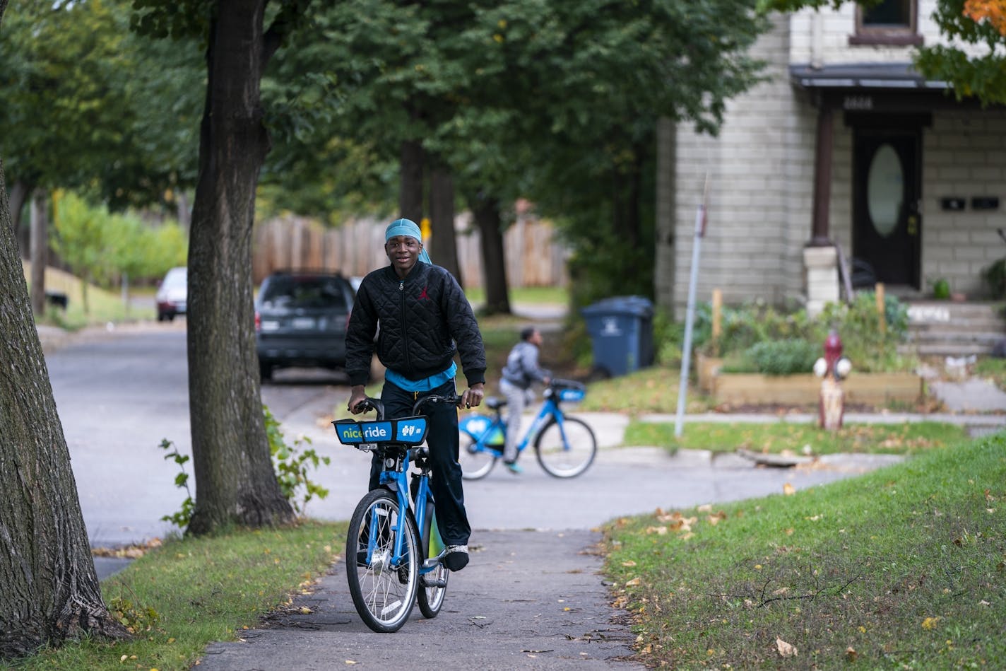 Some residents in the Hawthorne neighborhood of Minneapolis worry that more officers would lead to more harassment of black residents. Above, Keontray Mapp, 13, rode a bike near Farview Park.