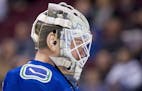 Vancouver Canucks goaltender Jacob Markstrom (25) is seen during a break in play during first period NHL hockey action against the Minnesota Wild in V