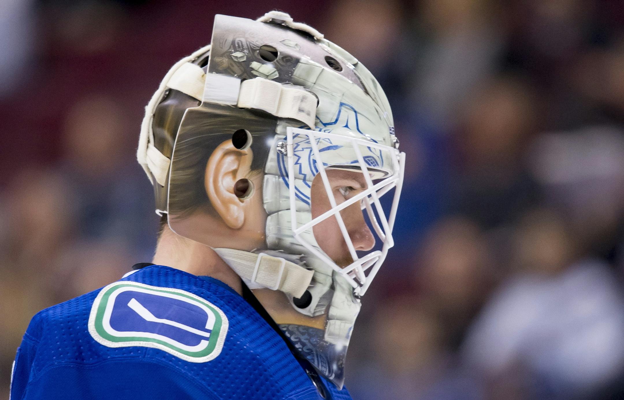 Vancouver Canucks goaltender Jacob Markstrom (25) is seen during a break in play during first period NHL hockey action against the Minnesota Wild in Vancouver, British Columbia, Monday, Oct. 29, 2018. (Jonathan Hayward/The Canadian Press via AP)