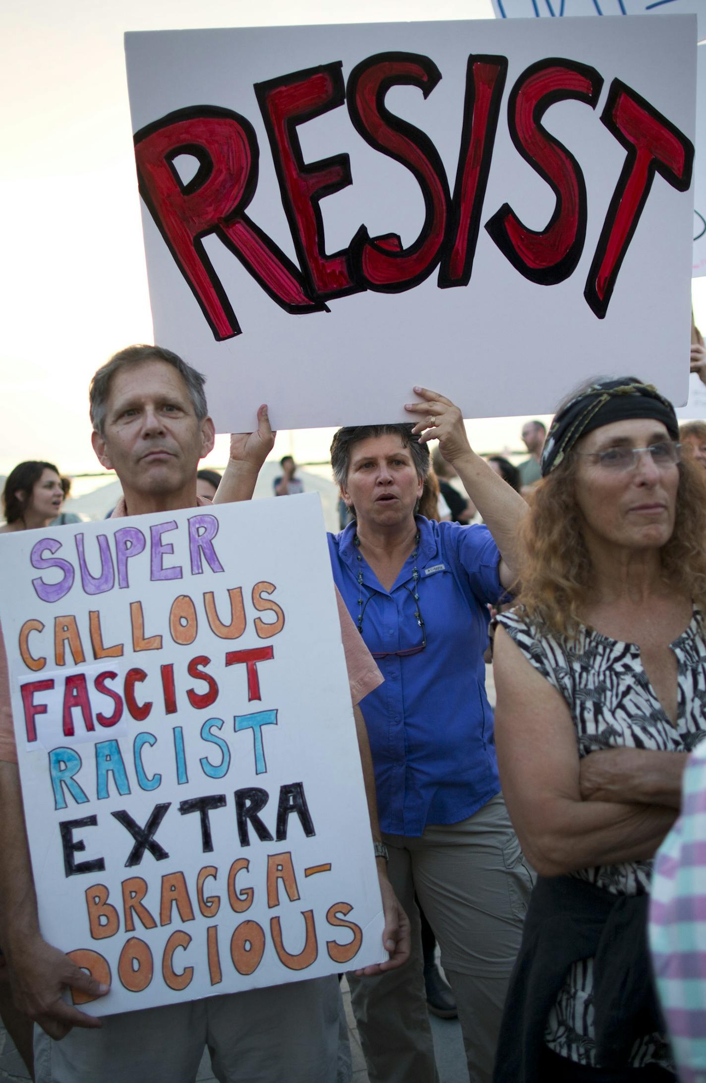 Israeli and American activists holds signs during a protest against President Donald Trump next to the U.S embassy in Tel Aviv, Israel Monday, May 22, 2017. (AP Photo/Oded Balilty) ORG XMIT: MIN2017061417474515