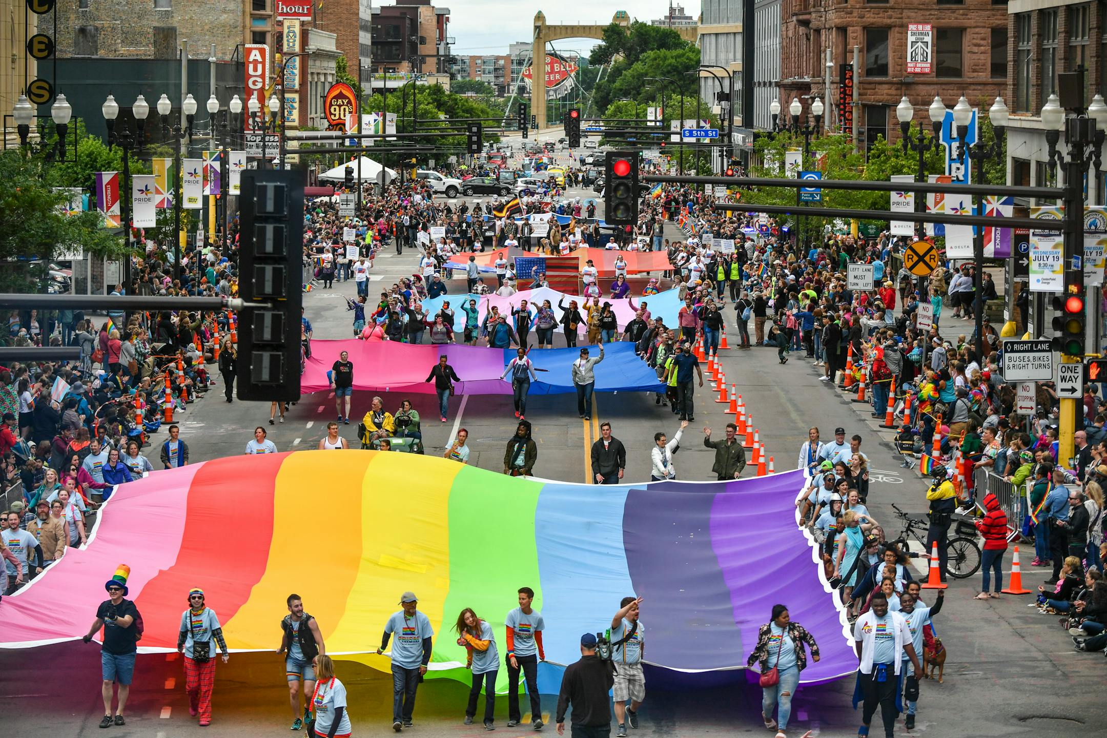 The Rainbow flag, Bi flag, Trans flag and Leather flag at the start of the Pride parade down Hennepin Ave, Minneapolis.     ] GLEN STUBBE ¥ glen.stubbe@startribune.com Sunday June 25, 2017  Coverage of annual Twin Cities Gay Pride Parade. Goes down Hennepin. News things to watch for are the aftermath of the cops being disinvited from marching (as of this writing, the parade organizers still hadn't reversed their decision. If they do, that will be good to get shots of the police contingent in the parade). Plus, is the parade much more political than in past years, because of Trump presidency? ORG XMIT: MIN1706251517500804