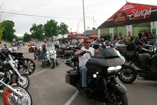 Bikers ride through downtown Sturgis, S.D., on Friday, Aug. 7, 2020. Organizers of the Sturgis Motorcycle Rally expect 250,000 people to visit the tow
