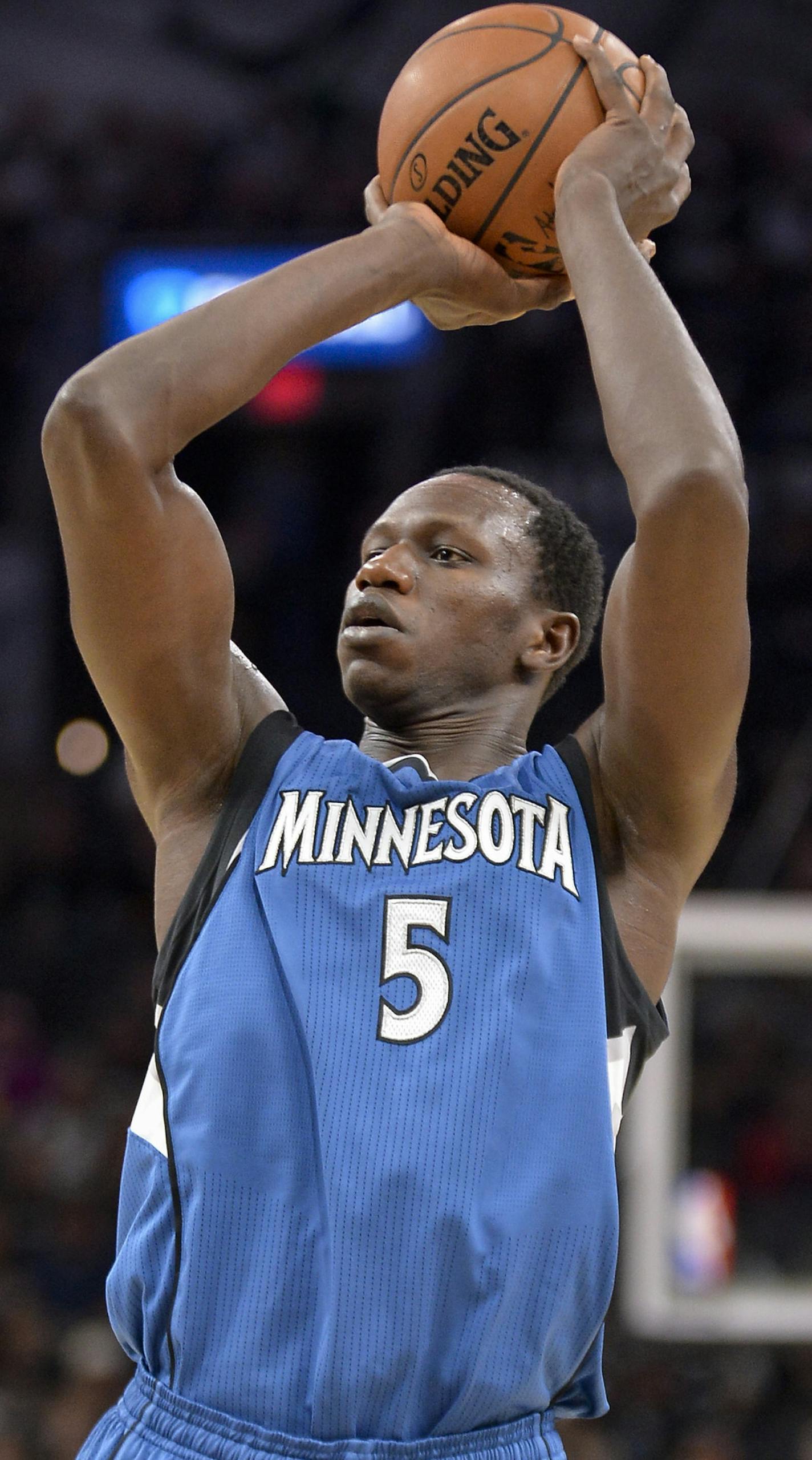 Minnesota Timberwolves center Gorgui Dieng shoots during the first half of the team's NBA basketball game against the San Antonio Spurs, Saturday, March 4, 2017, in San Antonio. (AP Photo/Darren Abate)