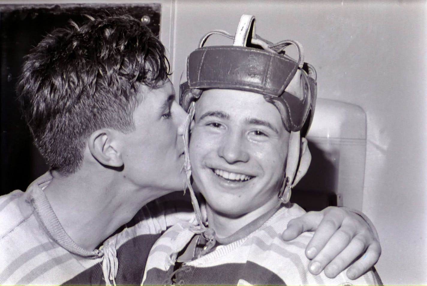 South St. Paul goaltender Gary McAlpine kissed teammate Doug Woog after the freshman scored the lone goal in the Packers' 1959 state tournament quarterfinal victory against Minneapolis Patrick Henry.